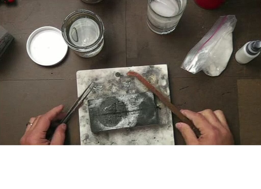 David Lee Smith using tweezers to handle hot silver after soldering