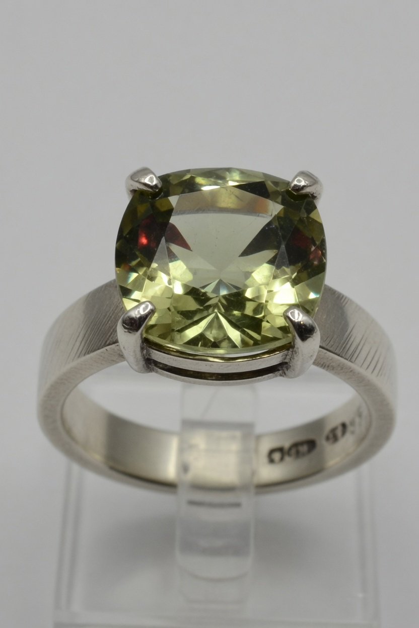 Faceted chrysoberyl in contemporary prong silver ring