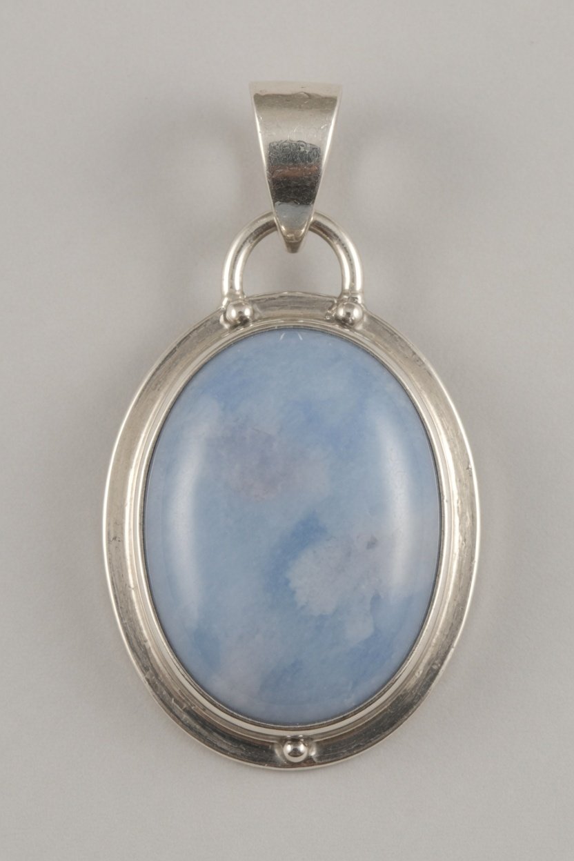 Angelite cabochon in classic silver bezel pendant